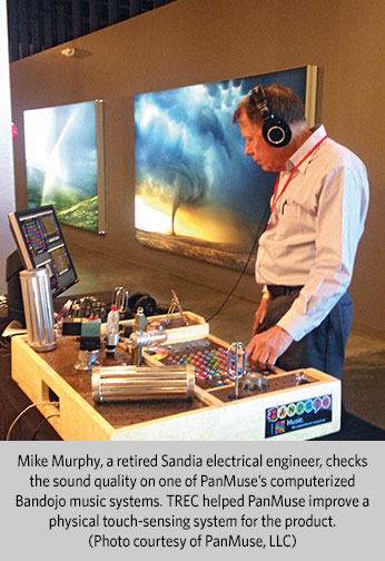 Mike Murphy, a retired Sandia electrical engineer, checks the sound quality on one of PanMuse’s computerized Bandojo music systems.